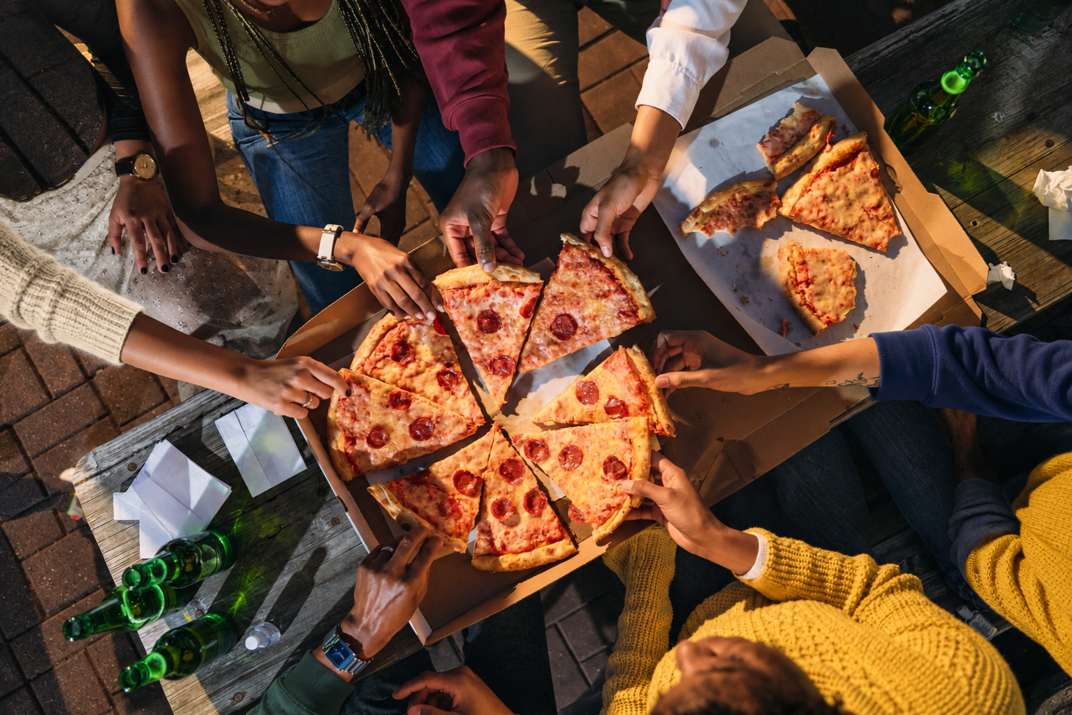 Friends sharing pizza at a party